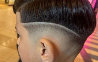 Children’s haircut with a fade and side part