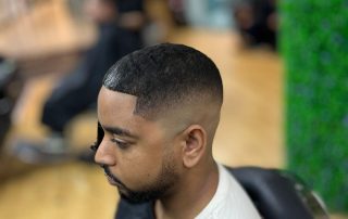 Short haircut and neatly shaped beard at Iconic Cuts