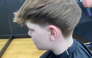 Children’s textured haircut with a tapered finish